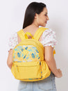 Caprese Xenia Backpack Medium Dual Compartment Yellow Printed