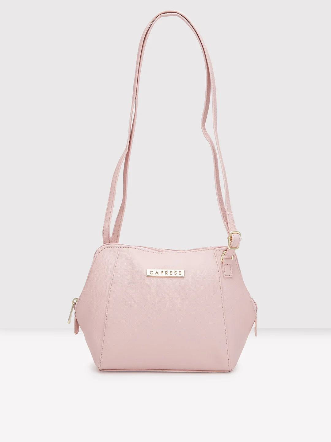 Caprese pink solid sling bag sale